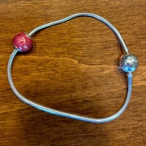 Pandora sterling silver bracelet (7inches) with pink gem